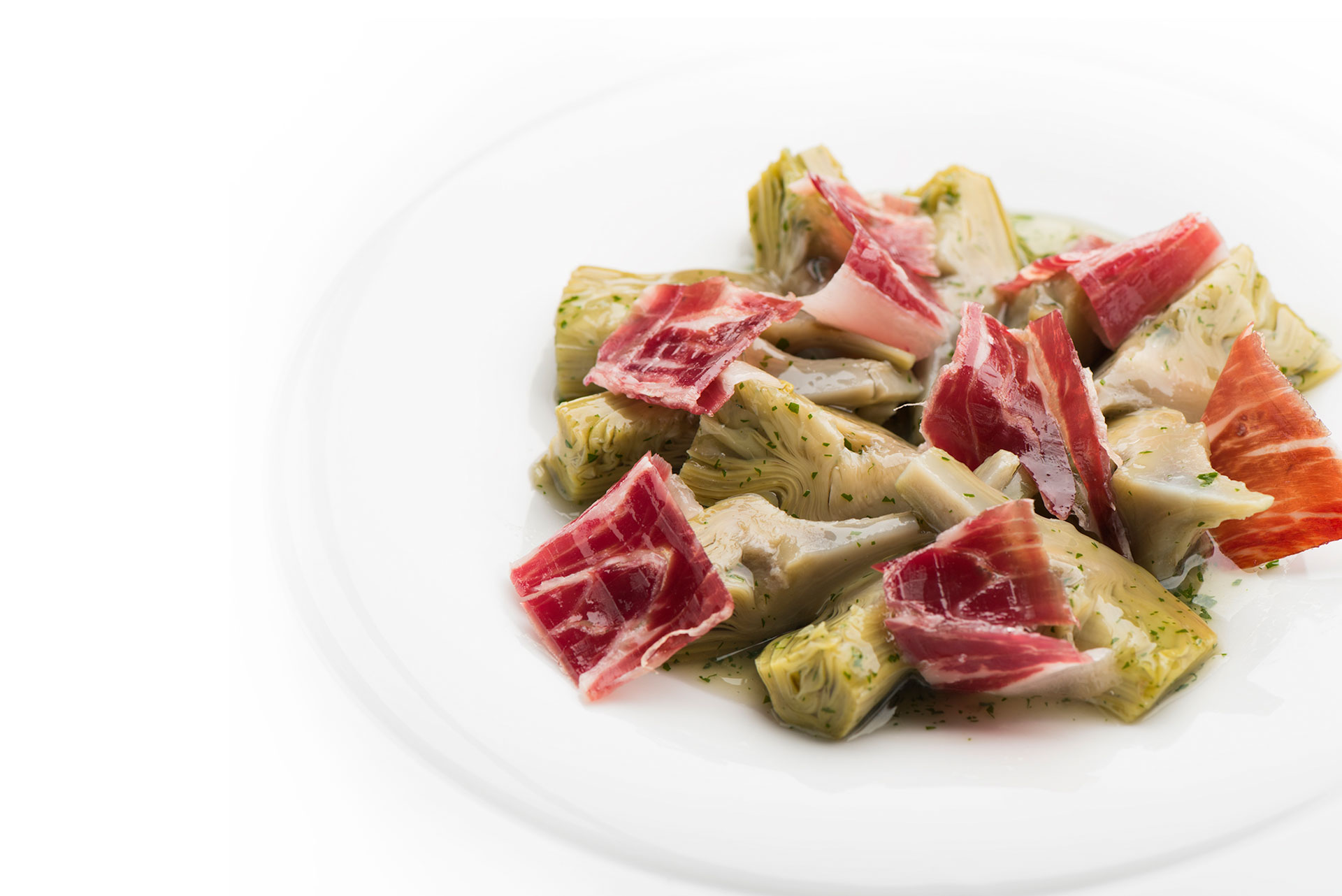 Artichokes in sauce with strips of Ham